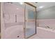 Shower includes a seat and grab bar providing a safe and comfortable bathing experience at 2023 Golfview Dr # 2023, Tarpon Springs, FL 34689