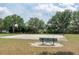 Community basketball court surrounded by lush trees, offering a recreational space at 206 147Th E St, Bradenton, FL 34212