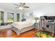 Bedroom with a comfortable bed, desk, and chair, offering a cozy and functional living space at 206 147Th E St, Bradenton, FL 34212