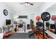 A well-lit room with weights and a desk, suitable for a home gym and office setup at 206 147Th E St, Bradenton, FL 34212