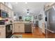 Bright, updated kitchen with stainless steel appliances, granite countertops, and hardwood floors at 206 147Th E St, Bradenton, FL 34212
