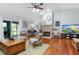 Spacious living room with hardwood floors, fireplace, and comfortable seating arrangement at 206 147Th E St, Bradenton, FL 34212