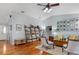 Bright living room with hardwood floors, comfortable seating, and a decorative ladder bookshelf at 206 147Th E St, Bradenton, FL 34212
