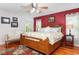 Spacious main bedroom featuring hardwood floors, ceiling fan, and natural light from two windows at 206 147Th E St, Bradenton, FL 34212