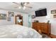 Spacious main bedroom featuring warm hardwood floors and a ceiling fan, bathed in natural light at 206 147Th E St, Bradenton, FL 34212