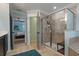 Modern bathroom features a tiled shower with glass enclosure and a view to the main bedroom at 2109 N Jamaica St, Tampa, FL 33607