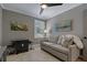 Neutral bonus room with media center, large television, and comfortable sofa seating area at 2109 N Jamaica St, Tampa, FL 33607