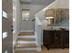 Inviting entryway with hardwood floors, staircase, and decorative mirror and artwork at 2109 N Jamaica St, Tampa, FL 33607