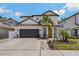 Stunning two-story home boasts modern architectural details, a two-car garage, and fresh landscaping at 2109 N Jamaica St, Tampa, FL 33607