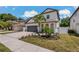 This two-story home features a two car garage and a well maintained landscaped yard and garden at 2109 N Jamaica St, Tampa, FL 33607