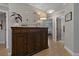 Hallway with hardwood floors and decorative furniture with decorative wall hangings at 2109 N Jamaica St, Tampa, FL 33607