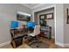 Functional home office with modern desk setup, dual monitors, and ample workspace at 2109 N Jamaica St, Tampa, FL 33607