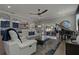 Spacious living room with stylish furnishings, a grand piano, and seamless access to the outdoor patio at 2109 N Jamaica St, Tampa, FL 33607