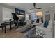Bright living room with a grand piano, stylish decor, and a view into the adjacent kitchen area at 2109 N Jamaica St, Tampa, FL 33607