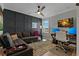 Stylish living room with a sectional sofa, accent wall, and a bright, open layout at 2109 N Jamaica St, Tampa, FL 33607