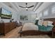 Calming main bedroom features a tray ceiling, plantation shutters, and stylish furniture at 2109 N Jamaica St, Tampa, FL 33607
