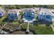 Aerial view of the house showcasing its prime waterfront location and pool area at 2111 Alexis Ct, Tarpon Springs, FL 34689