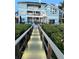 Backyard with dock access, pool, and access to the home at 2111 Alexis Ct, Tarpon Springs, FL 34689