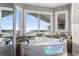Bathroom view showcasing large jacuzzi tub with water views and refined vanity design at 2111 Alexis Ct, Tarpon Springs, FL 34689