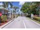 Gated community entrance featuring manicured landscaping and secured access at 2111 Alexis Ct, Tarpon Springs, FL 34689