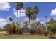 Welcoming entrance to Harbour Watch featuring lush landscaping and a waterfront preserve at 2111 Alexis Ct, Tarpon Springs, FL 34689