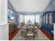 Dining room showcasing a large table set for eight, with hardwood floors, and natural light at 2111 Alexis Ct, Tarpon Springs, FL 34689
