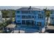 Aerial view of the home with back patio, pool, gazebo, and lush landscaping at 2111 Alexis Ct, Tarpon Springs, FL 34689