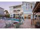 This backyard includes a pool, a fire pit, an outdoor kitchen and outdoor seating at 2111 Alexis Ct, Tarpon Springs, FL 34689