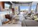 Spacious living room with a large sectional sofa and access to the outdoors at 2111 Alexis Ct, Tarpon Springs, FL 34689