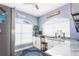 Bright office space with large windows, white cabinets, and granite countertops at 2111 Alexis Ct, Tarpon Springs, FL 34689
