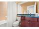 Bathroom with a tub, toilet, and vanity with a sink at 2671 Lakebreeze S Ln, Clearwater, FL 33759