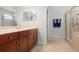 Bathroom features a vanity, walk-in shower, and a linen closet at 2671 Lakebreeze S Ln, Clearwater, FL 33759