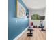 A home gym featuring durable floors, bright lighting, and essential equipment for a complete workout at 2671 Lakebreeze S Ln, Clearwater, FL 33759