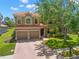 Charming two-story home with a tile roof and a two-car garage at 2671 Lakebreeze S Ln, Clearwater, FL 33759