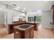 Modern kitchen featuring island cooktop, breakfast bar, and seamless transitions at 2671 Lakebreeze S Ln, Clearwater, FL 33759