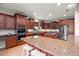 Spacious kitchen with ample counter space, breakfast bar, and stainless appliances at 2671 Lakebreeze S Ln, Clearwater, FL 33759