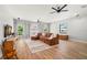 Spacious living room filled with natural light and wood flooring at 2671 Lakebreeze S Ln, Clearwater, FL 33759