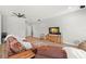 Open living room featuring neutral walls, wood floors, and an entertainment center at 2671 Lakebreeze S Ln, Clearwater, FL 33759