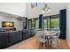 Cozy living room with dining area featuring pool views and comfortable seating at 2671 Lakebreeze S Ln, Clearwater, FL 33759