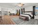Expansive main bedroom with decorative rug, ceiling fans, and natural light at 2671 Lakebreeze S Ln, Clearwater, FL 33759