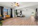 Large primary bedroom with ceiling fan, decorative rug, and natural light at 2671 Lakebreeze S Ln, Clearwater, FL 33759