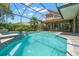 Beautiful pool area with a screen enclosure, custom tile work, and a built-in spa at 2671 Lakebreeze S Ln, Clearwater, FL 33759