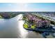 Aerial view of canal front condos with boat docks, lush greenery, and a lovely community gazebo at 2741 Via Cipriani # 931A, Clearwater, FL 33764