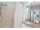 Bright bathroom featuring a shower-tub combination and a granite countertop vanity at 2741 Via Cipriani # 931A, Clearwater, FL 33764