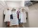 Organized walk-in closet featuring shelving and a dresser, maximizing storage space at 2741 Via Cipriani # 931A, Clearwater, FL 33764