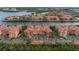 An exterior aerial view of condos with well-maintained landscaping and parking at 2741 Via Cipriani # 931A, Clearwater, FL 33764
