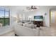 Bright living room features tile floors, neutral walls, and an eat-in kitchen at 2741 Via Cipriani # 931A, Clearwater, FL 33764