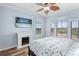 Bright main bedroom offers great natural light and a decorative fireplace at 2741 Via Cipriani # 931A, Clearwater, FL 33764