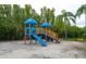Community playground area including a play structure with slides and other play features at 2741 Via Cipriani # 931A, Clearwater, FL 33764