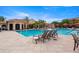 Inviting pool area with comfortable lounge chairs and cabanas for relaxation at 2741 Via Cipriani # 931A, Clearwater, FL 33764